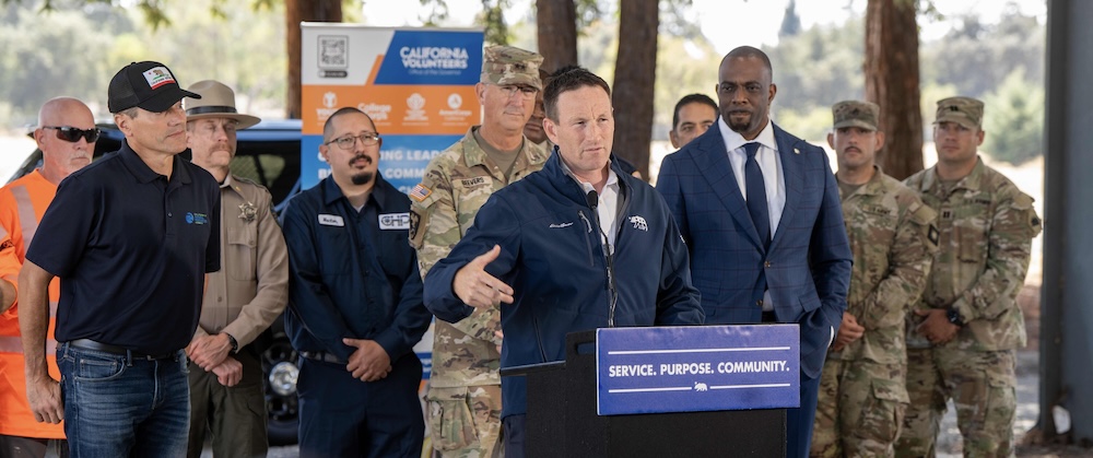 Director Fryday, flanked by Secretary Crowfoot, Major General Beevers and California Transportation Secretary Omishakin, calls on men to find purpose, belonging and opportunities through a career in public service.